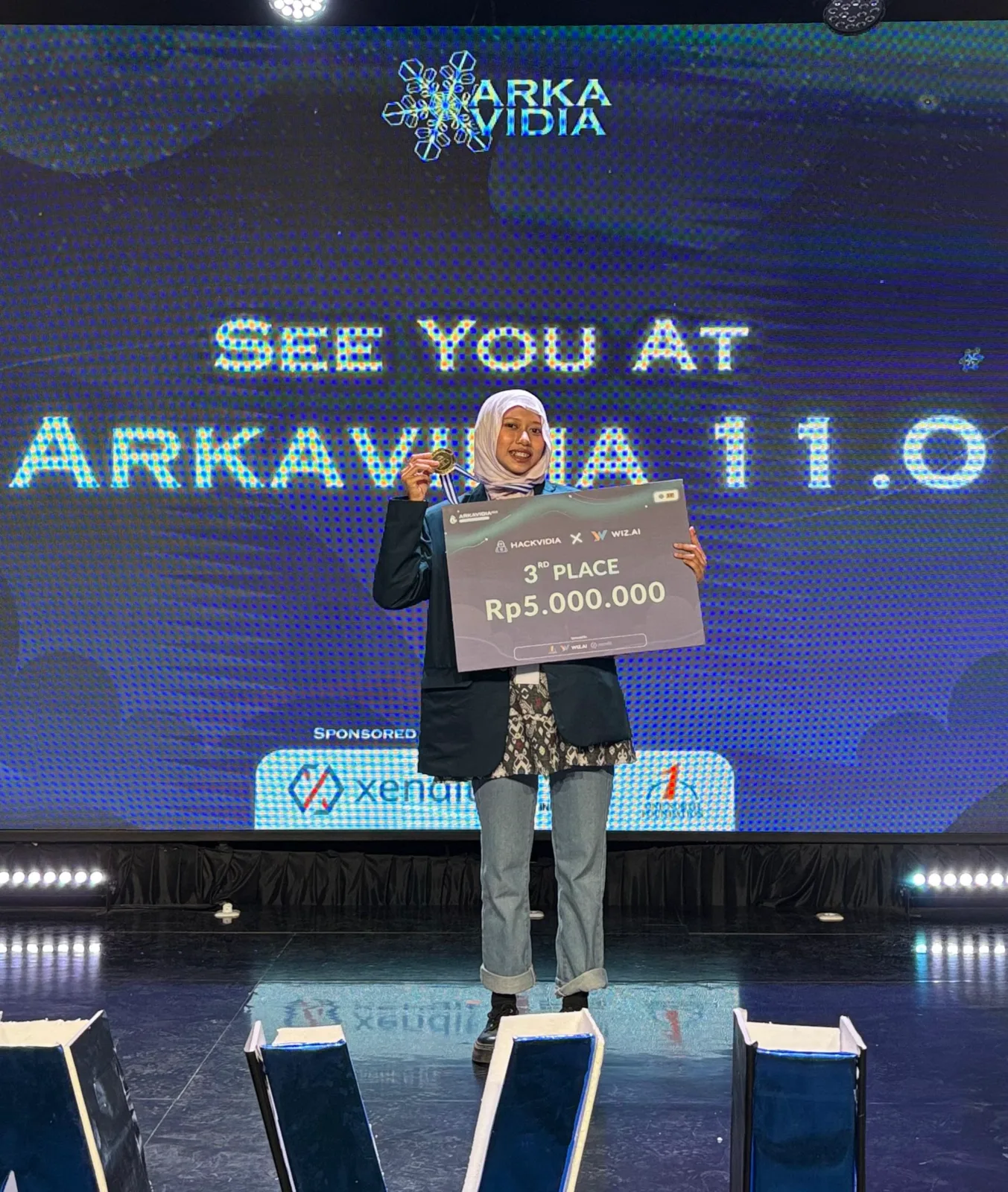 me holding my third-place medal and prize board