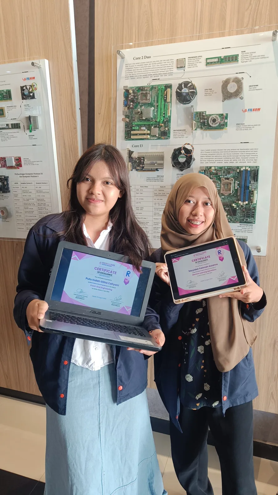 me and my friend, Indah, displaying both of our SISTECH certificates of excellence