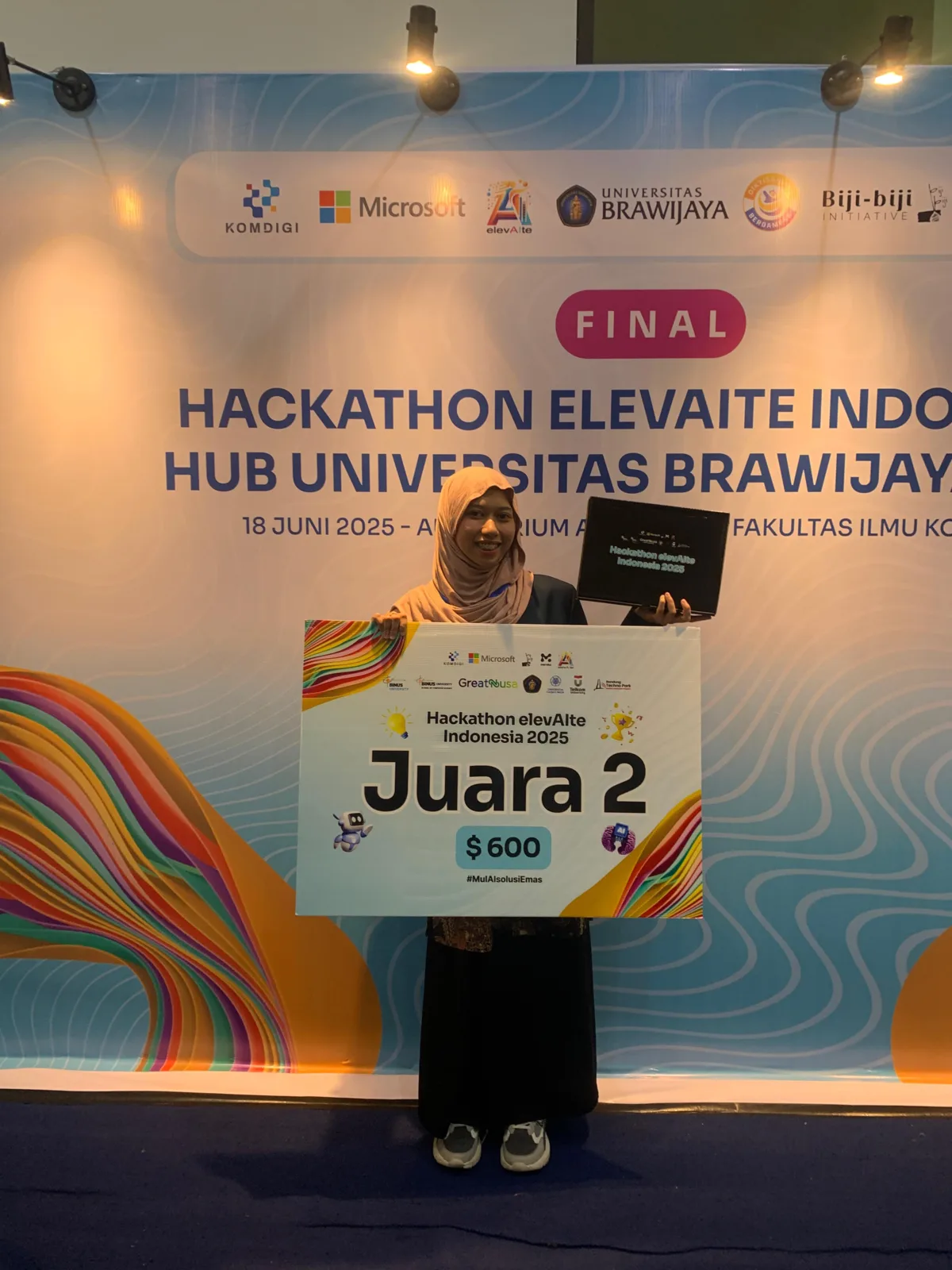 me holding the second-place prize at Hackathon elevAIte Indonesia