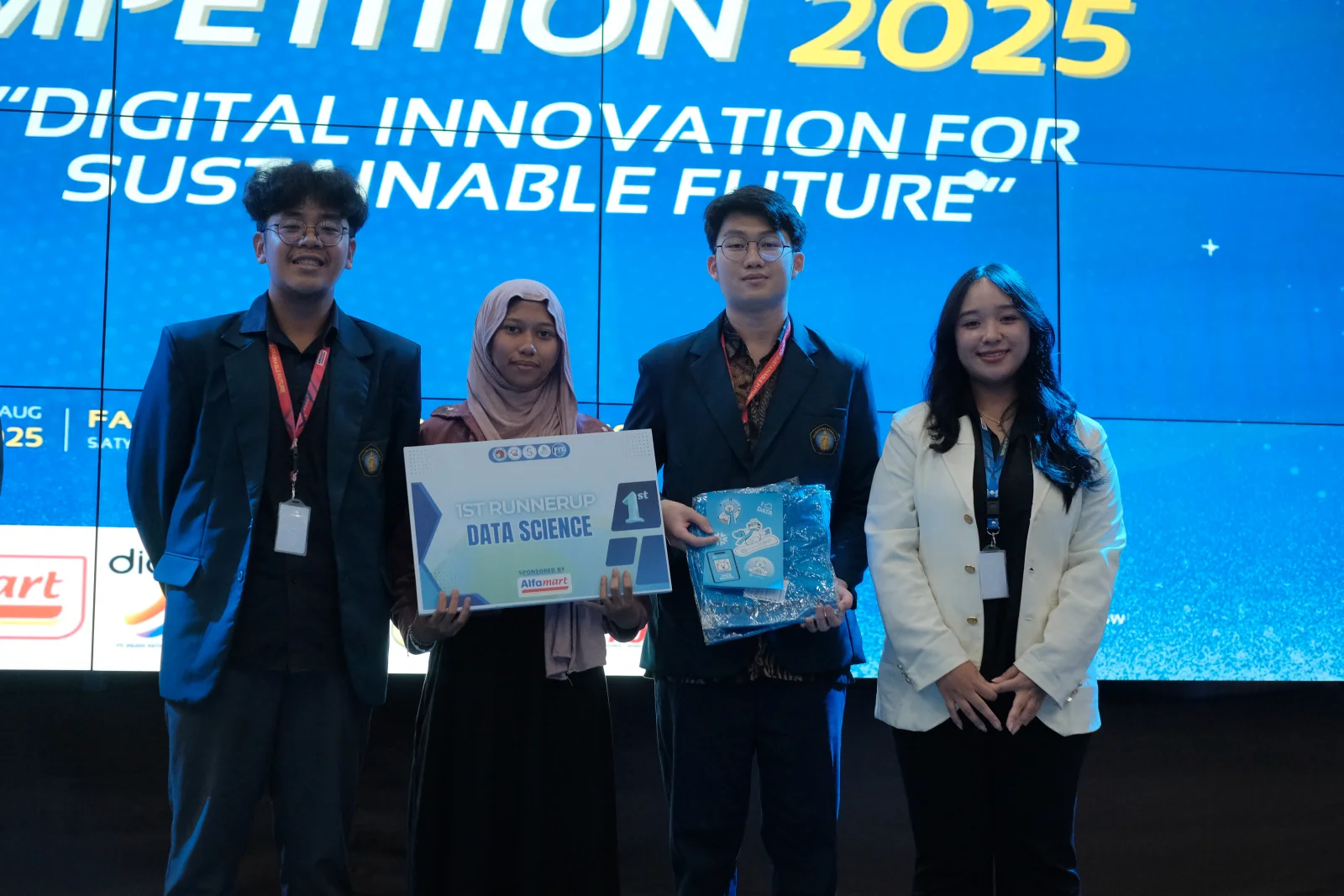 me and my team holding a first runner-up data science award at a competition held by UKSW